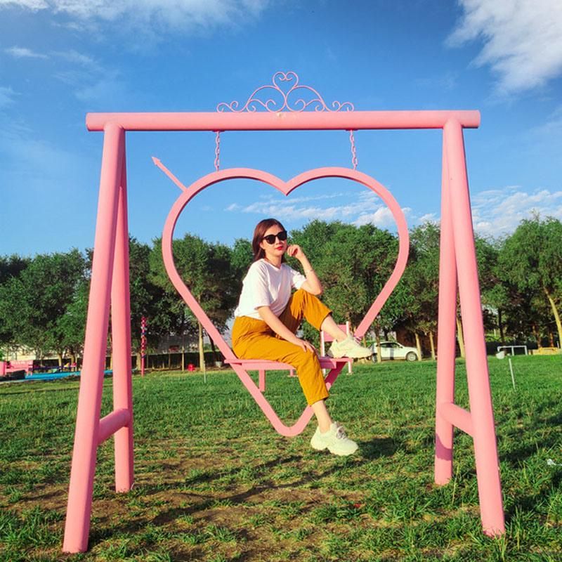 Heart Shape Bench Swing Seat for Tourism Photograph