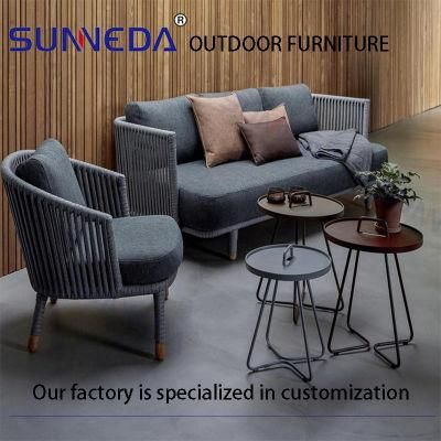 a Three-Person Sofa with Tarpaulin Cushions and End Tables