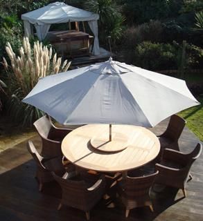 Rattan Chair With Wooden Table and Umbrella