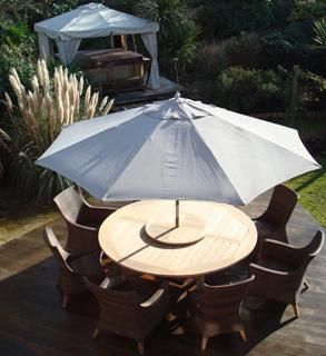 Rattan Chair With Wooden Table and Umbrella